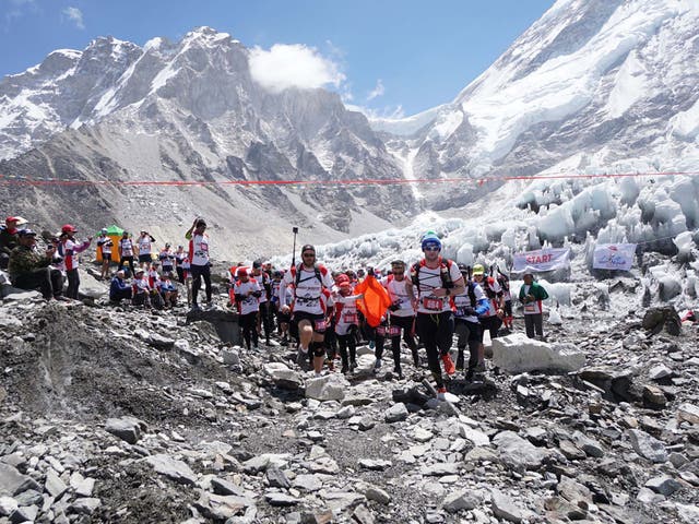 Runners take part in the marathon in the foothills of Mount Everest in Nepal