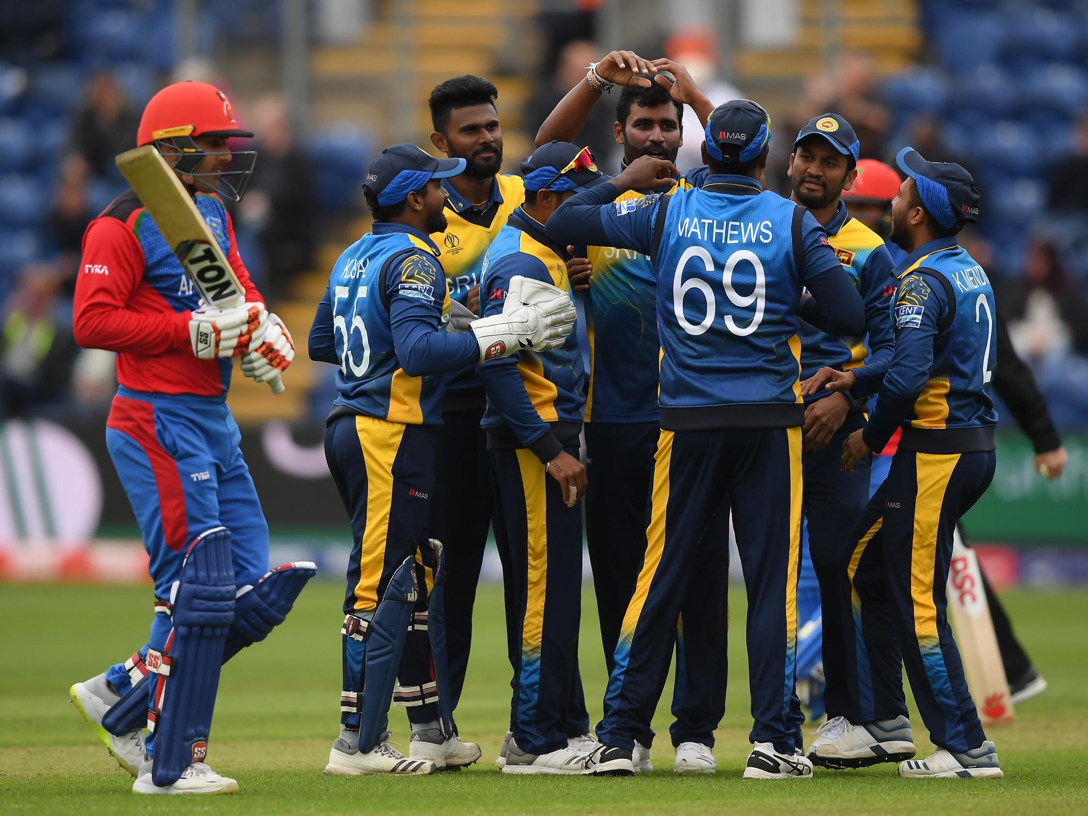 Thisara Perera celebrates with teammates after dismissing Mohammad Nabi