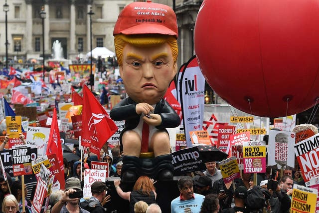 Anti-Trump protesters march down Whitehall.