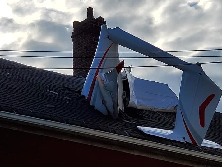 The wreckage of the plane in the roof of the two-storey home in Danbury