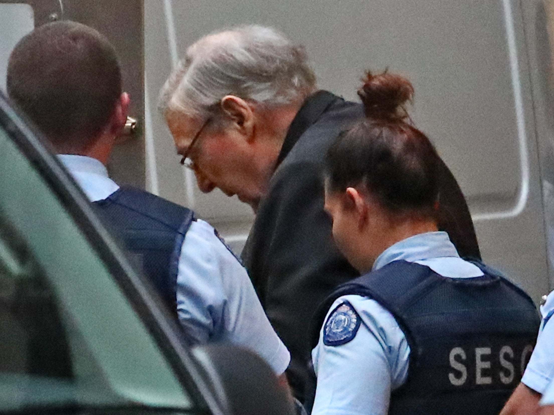 Cardinal George Pell leaves the Supreme Court of Victoria after his appeal hearing opened on Wednesday