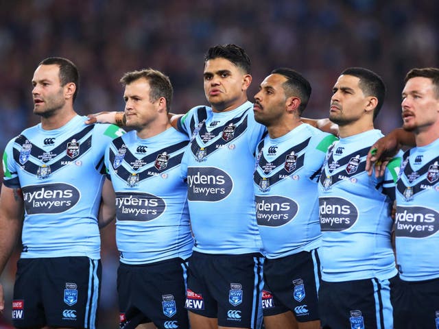 Latrell Mitchell, centre, stays silent alonside his New South Wales Blues team-mates
