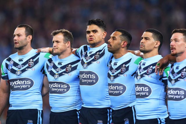 Latrell Mitchell, centre, stays silent alonside his New South Wales Blues team-mates