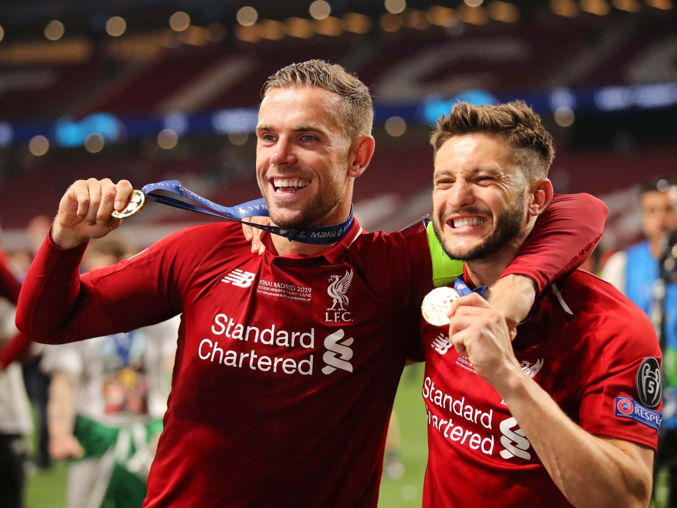 Lallana celebrates with Jordan Hendserson after Champions League final victory