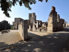 Holocaust denial graffiti daubed on Nazi massacre site in France