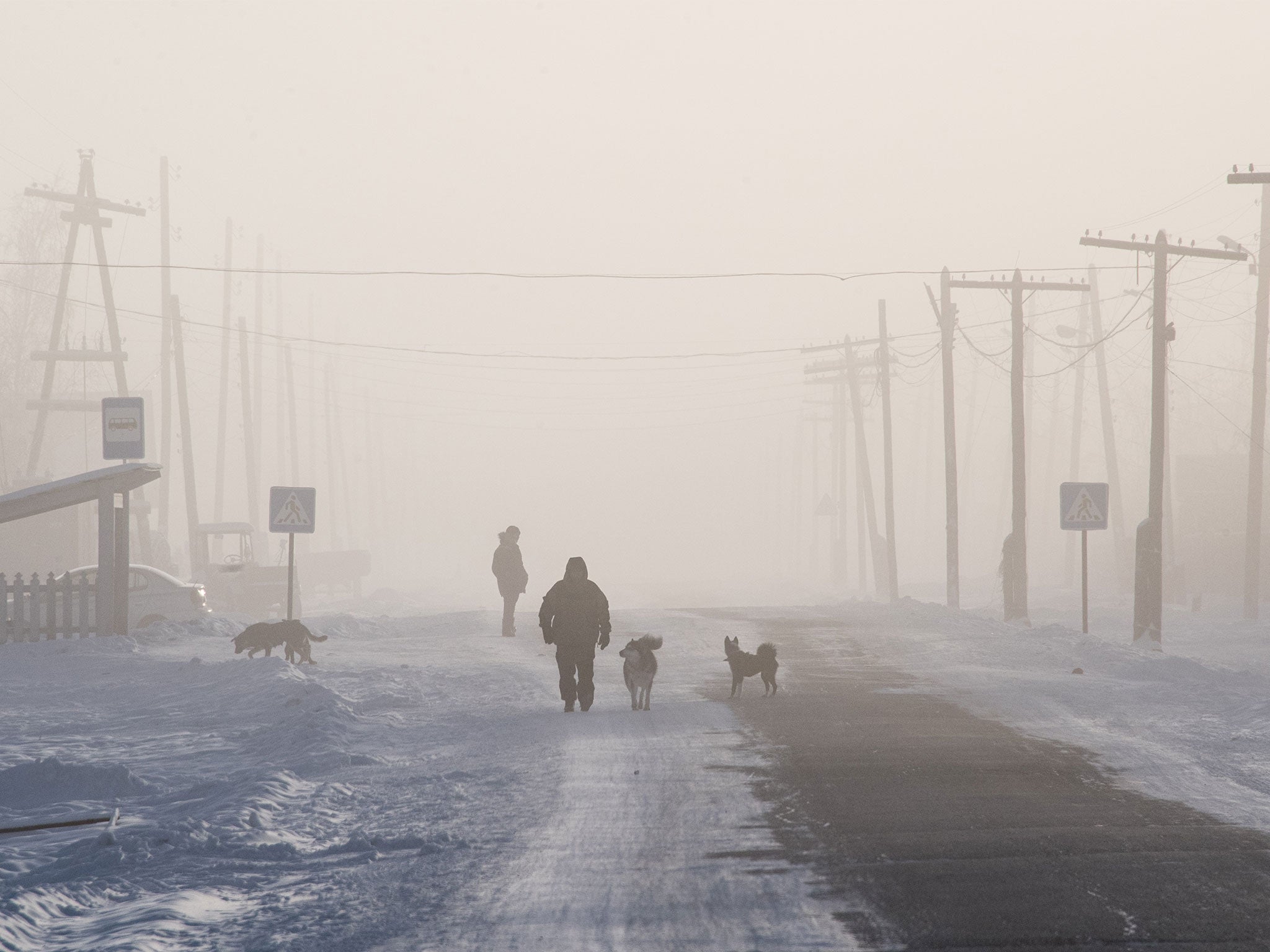 A man walks on the main street of the settlement of Oy, south of Yakutsk, Siberia, with the air temperature at about minus 41C