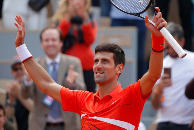 Novak Djokovic celebrates defeating Alexander Zverev