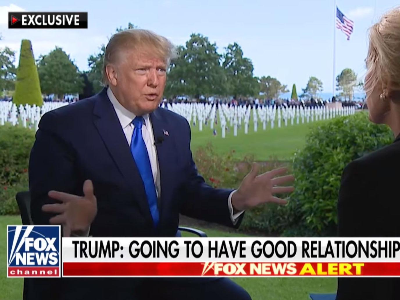 President Donald Trump being interviewed by Fox's Laura Ingraham in front of the Normandy American Cemetery in northern France
