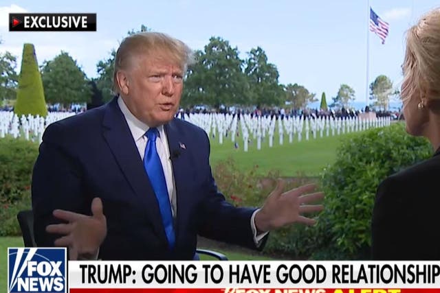 President Donald Trump being interviewed by Fox's Laura Ingraham in front of the Normandy American Cemetery in northern France