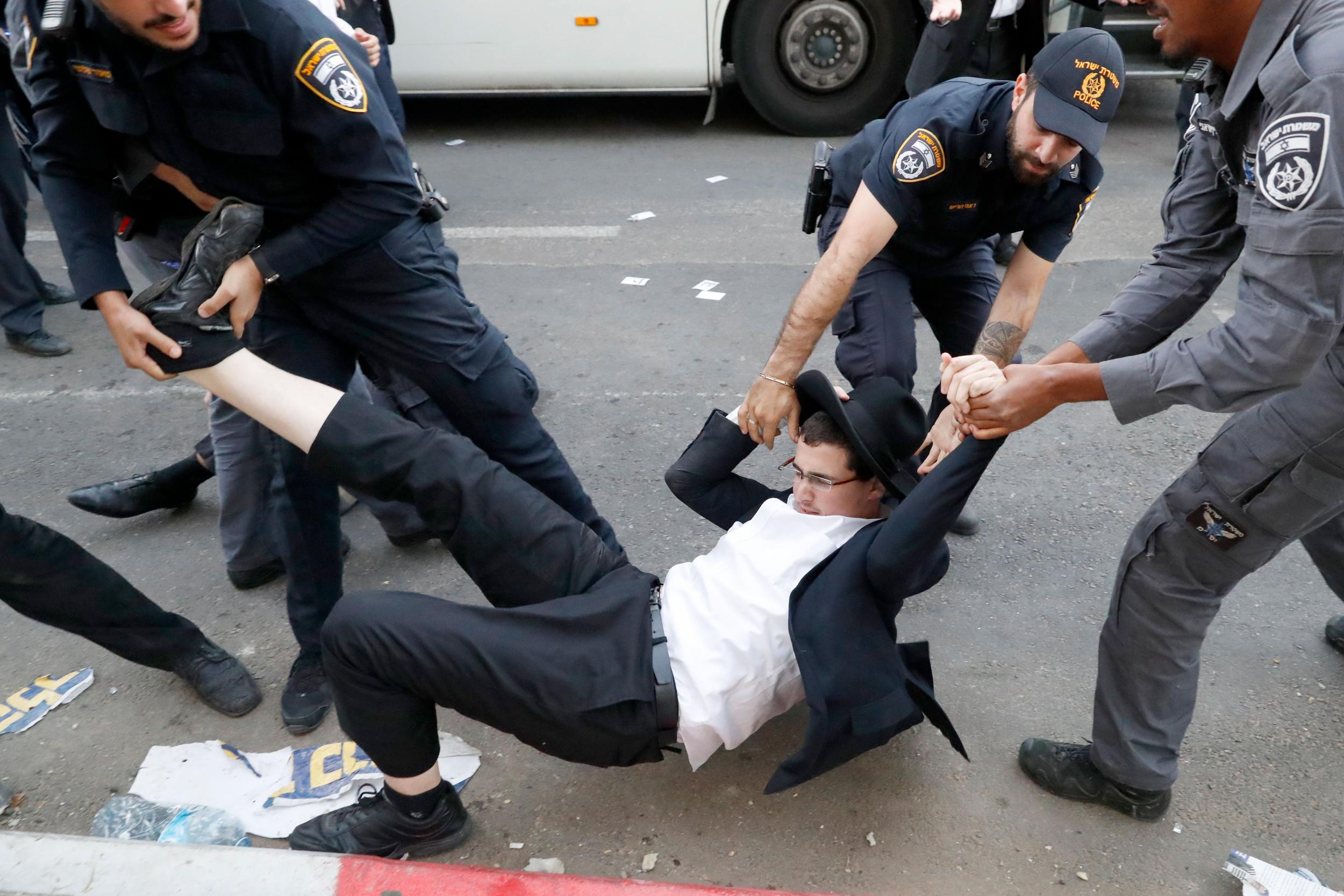 Israeli police disperse a group of Haredi Jews during a demonstration against Israeli army conscription in Bnei Brak, near Tel Aviv, in November (AFP/Getty)