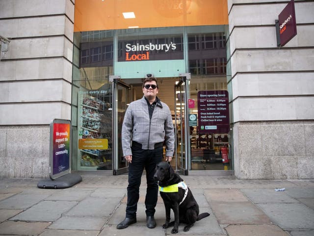 British Paralympic skiing champion John Dickinson-Lilley, with his guide dog Brett