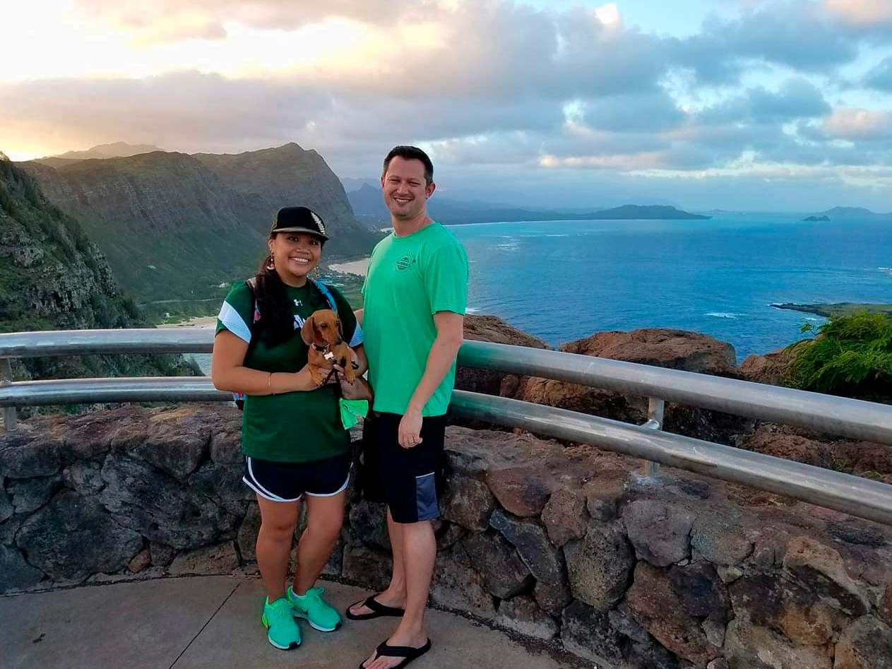 Michelle Paul and David Paul, along with their dog Zooey, in Hawaii.