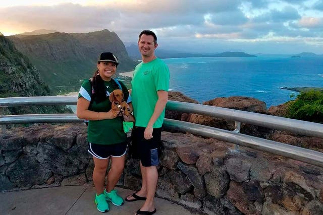 Michelle Paul and David Paul, along with their dog Zooey, in Hawaii.