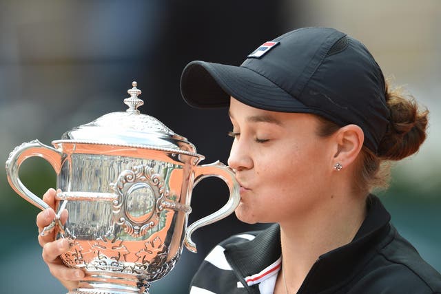 Barty holds her trophy