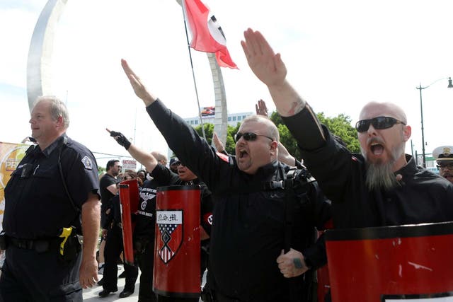 National Socialist Movement members demonstrate against the LGBTQ event Motor City Pride