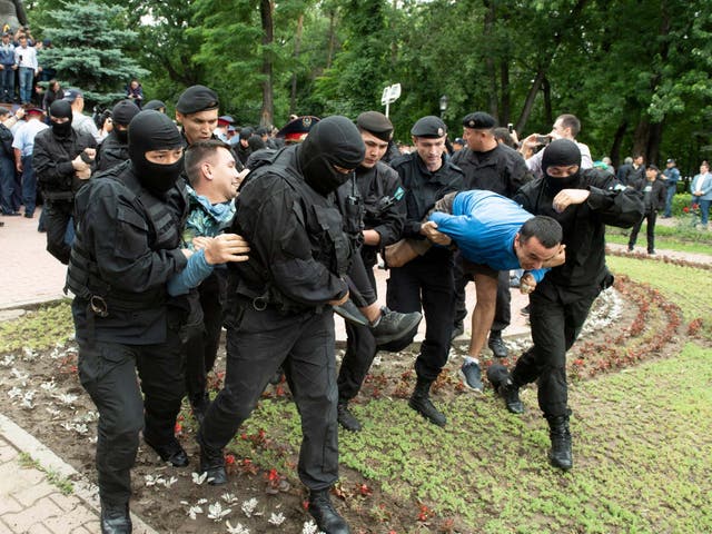Kazakh police detain demonstrators at anti-government protests in Almaty