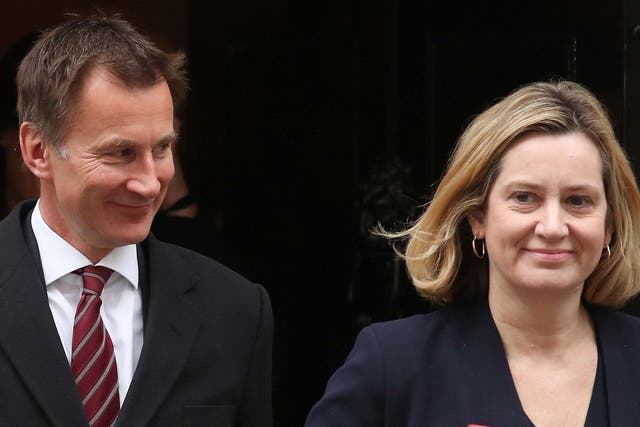 Cabinet colleagues Jeremy Hunt and Amber Rudd leave a cabinet meeting at 10 Downing Street