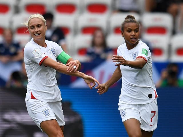 Nikita Parris celebrates scoring England's opening goal against Scotland