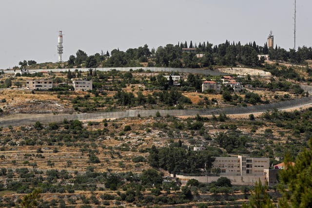 This picture taken on June 6, 2019 shows Israel's controversial separation barrier separating the West Bank city of Beit Jala near Bethlehem and Jerusalem