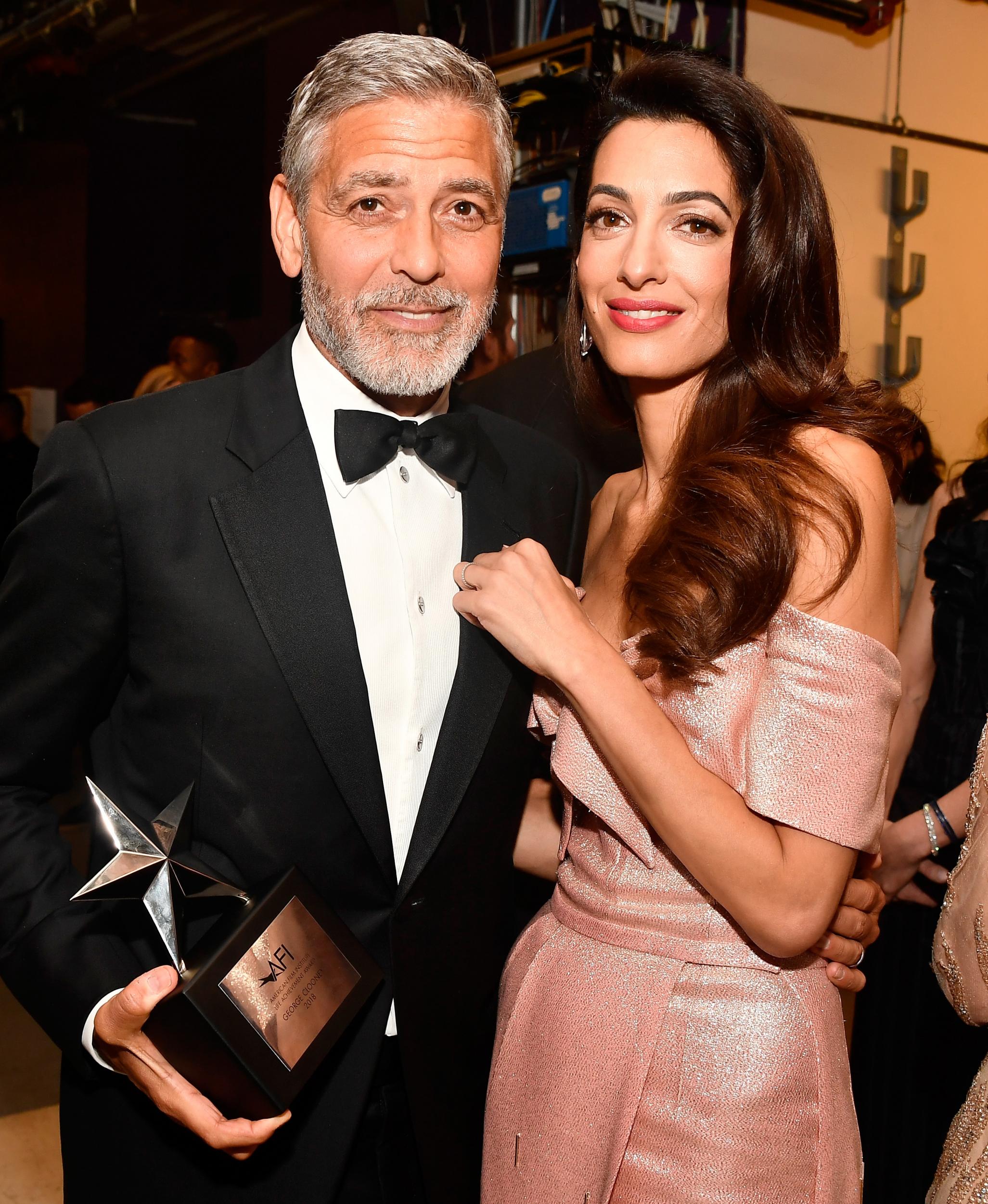 George Clooney (L) and Amal Clooney attend the American Film Institute's 46th Life Achievement Award Gala Tribute to George Clooney at Dolby Theatre on 7 June 2018 in Hollywood, California.