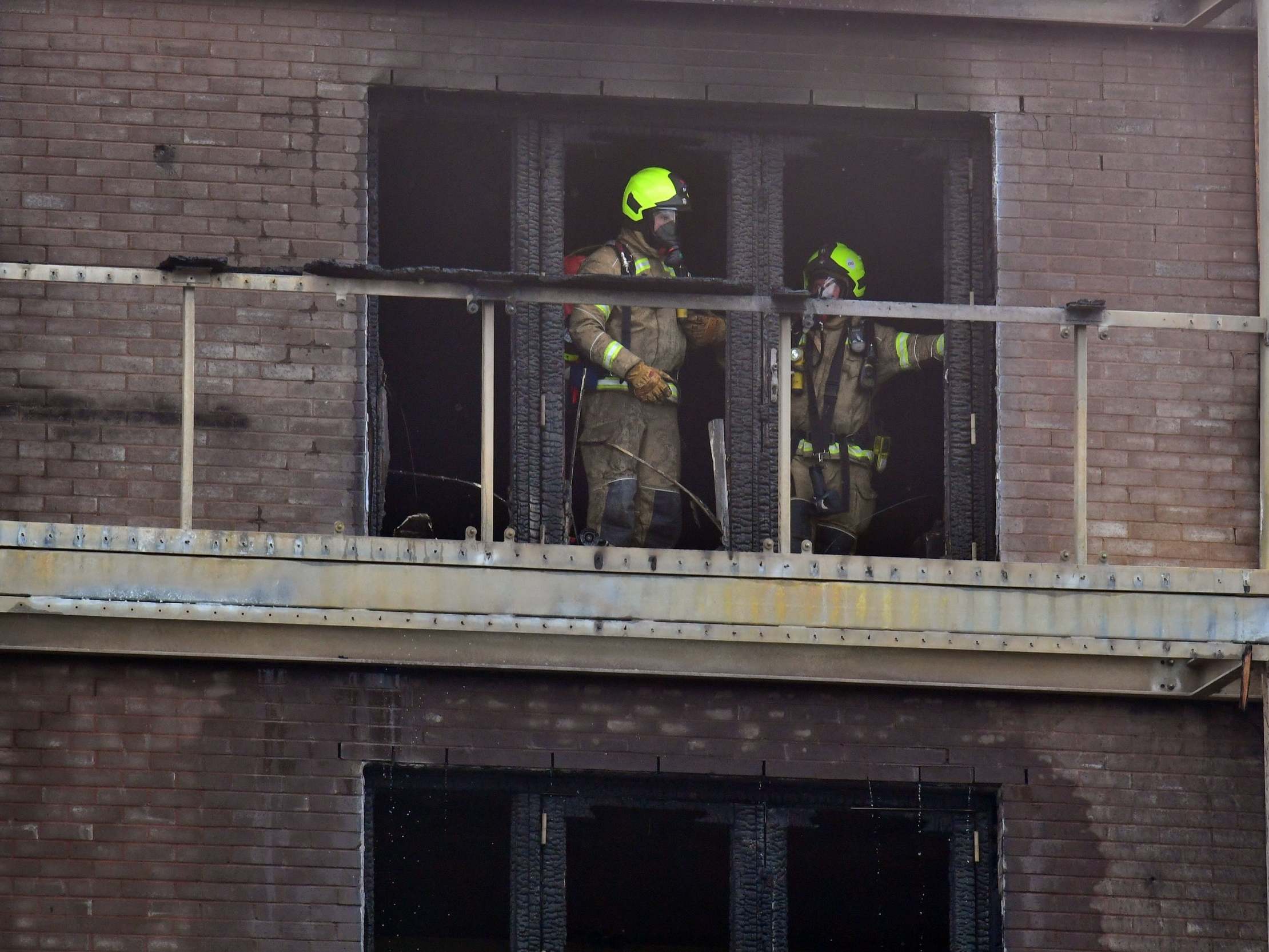 Firefighters deal with the blaze at a block of flats in Barking