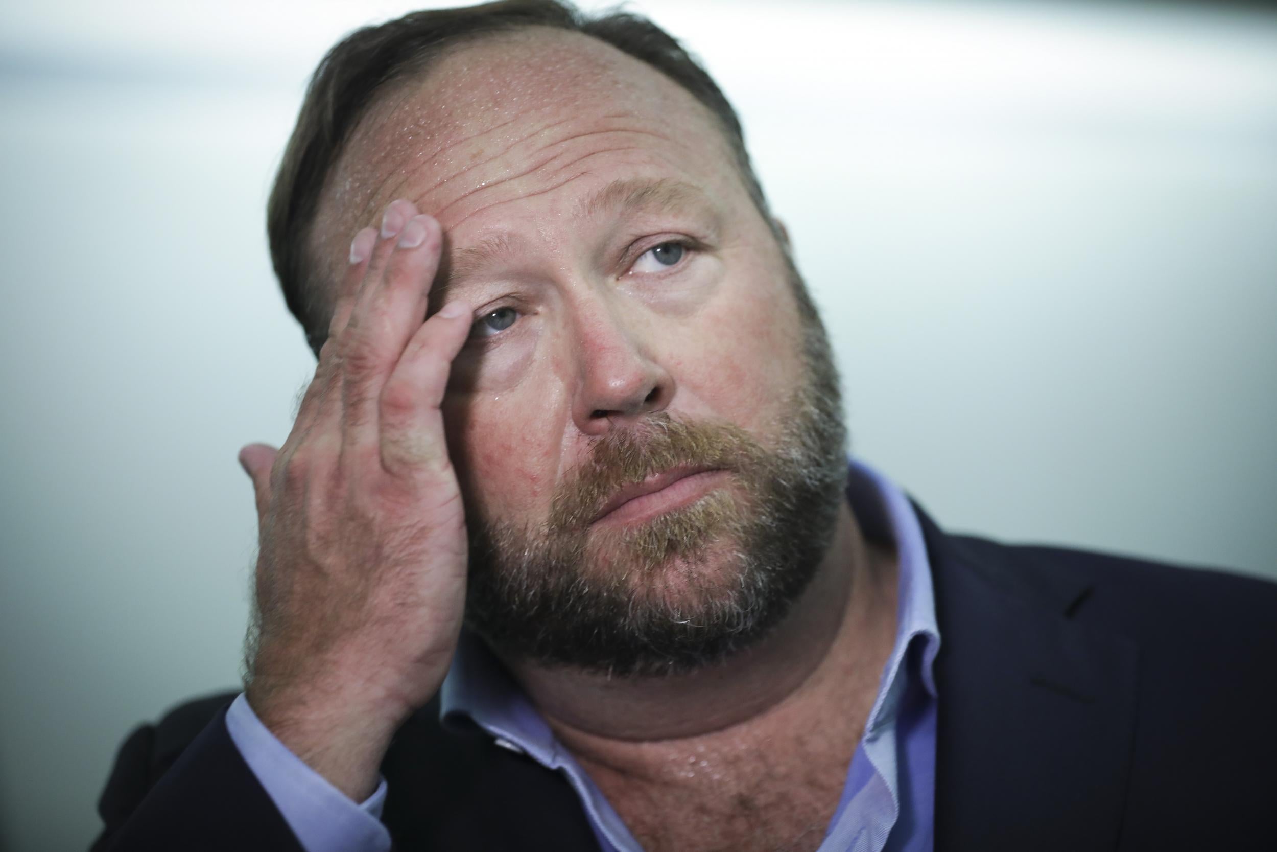 Alex Jones' (above) conspiracy site Infowars to pay $15,000 settlement in copyright dispute over Pepe the Frog cartoon