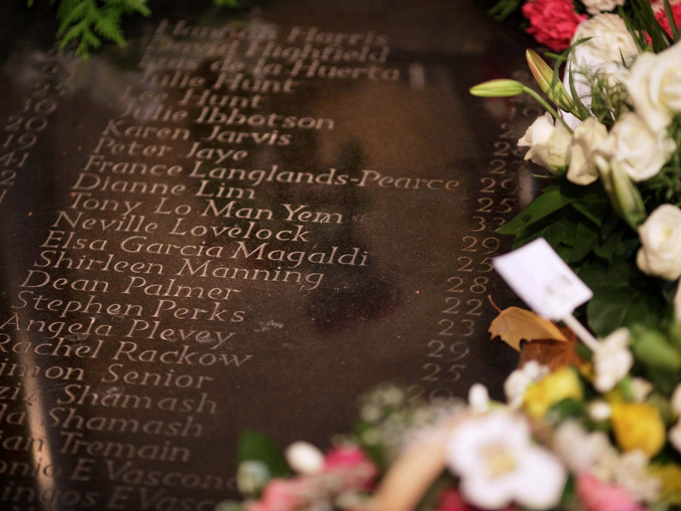 The names of victims, and their ages, on the memorial at Southwark Cathedral