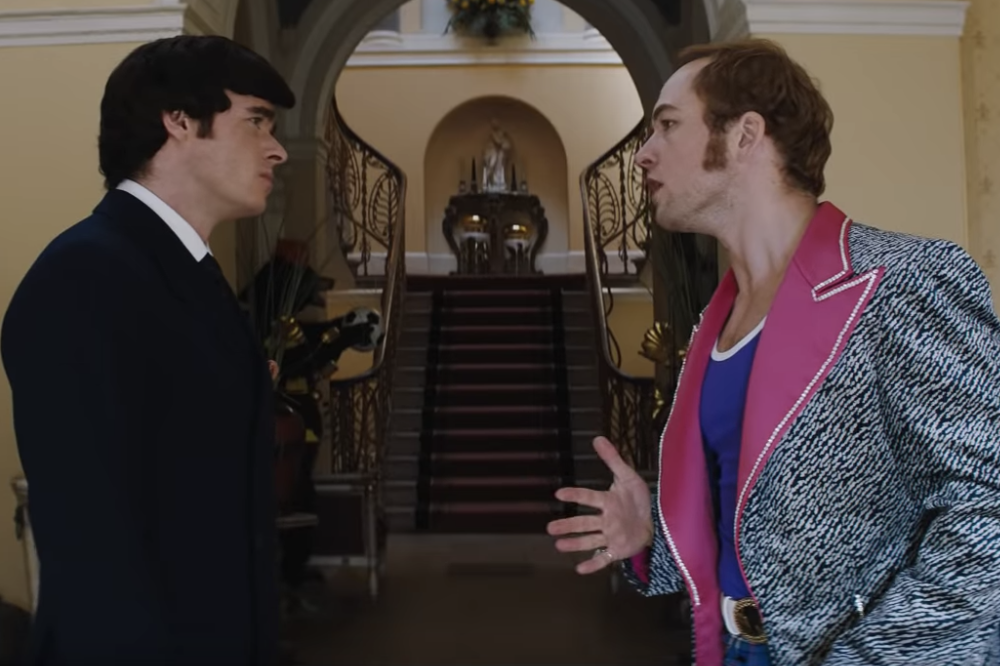 Richard Madden as John Reid and Taron Egerton as Elton John in Rocketman.