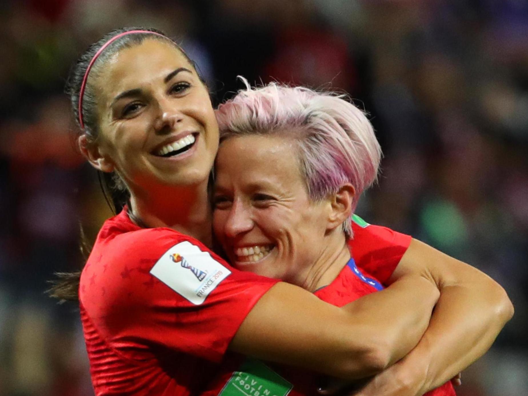 Alex Morgan celebrates her fifth goal with team-mate Megan Rapinoe