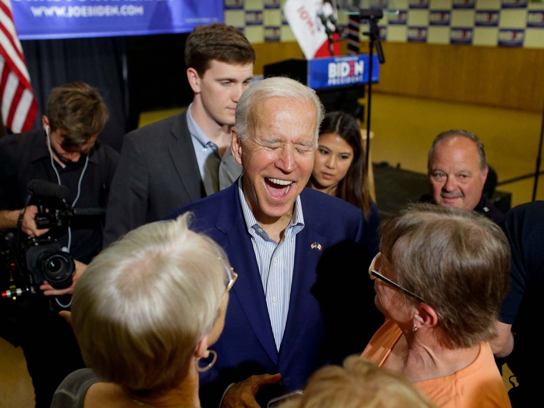 Former vice president and 2020 Democratic presidential candidate Joe Biden laughs as greets attendees during a campaign event on 11 June 2019 in Davenport, Iowa.