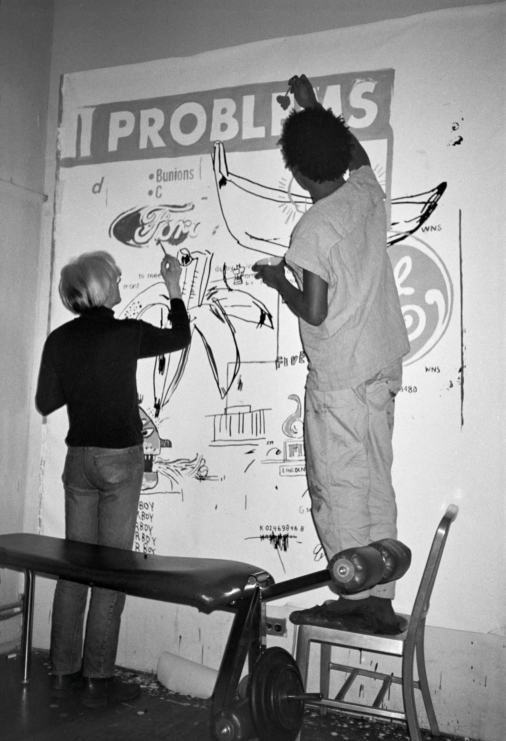Andy and Jean-Michel painting ‘Problems’ at Andy’s studio at 860 Broadway, 27 March 1984