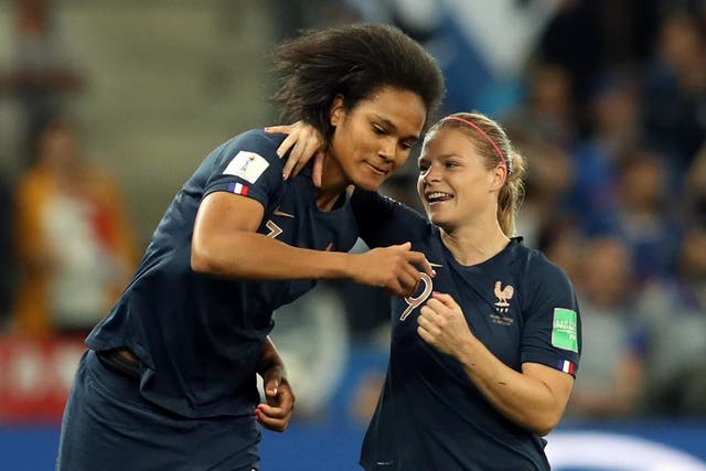 Wendie Renard celebrates France's second goal with Eugenie Le Sommer