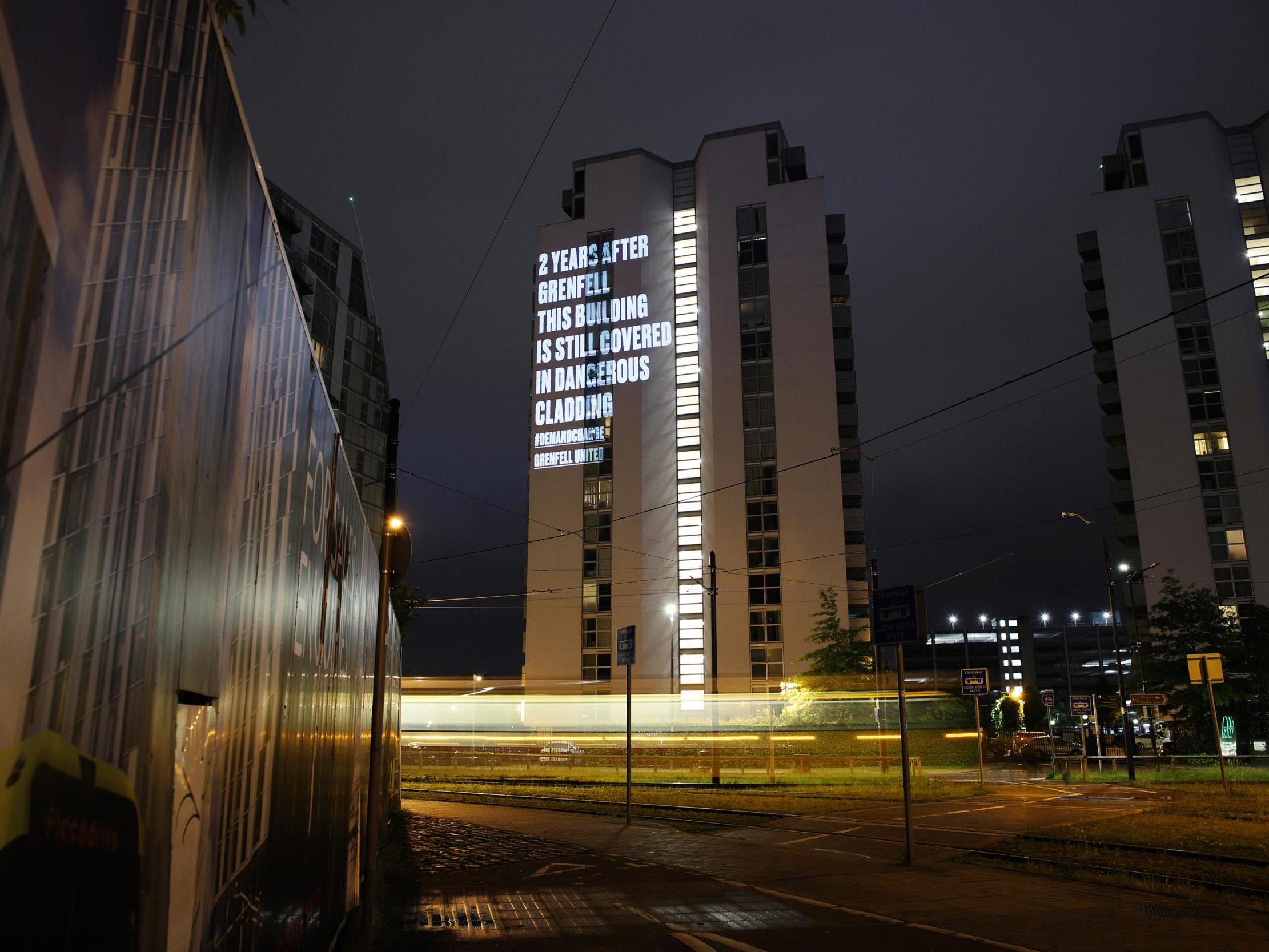 Grenfell United projected a message on to ?one of the?NV Buildings in Salford