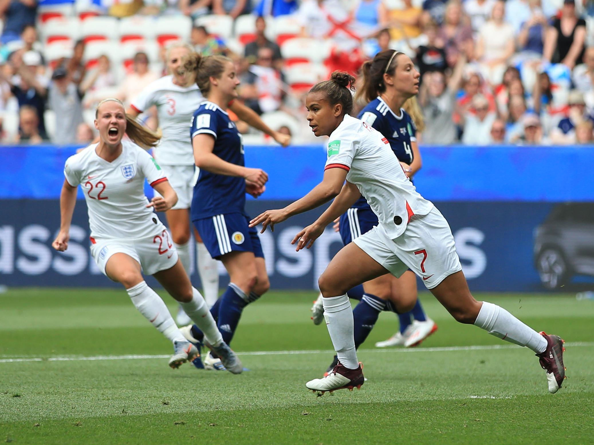 Nikita Parris celebrates scoring against Scotland