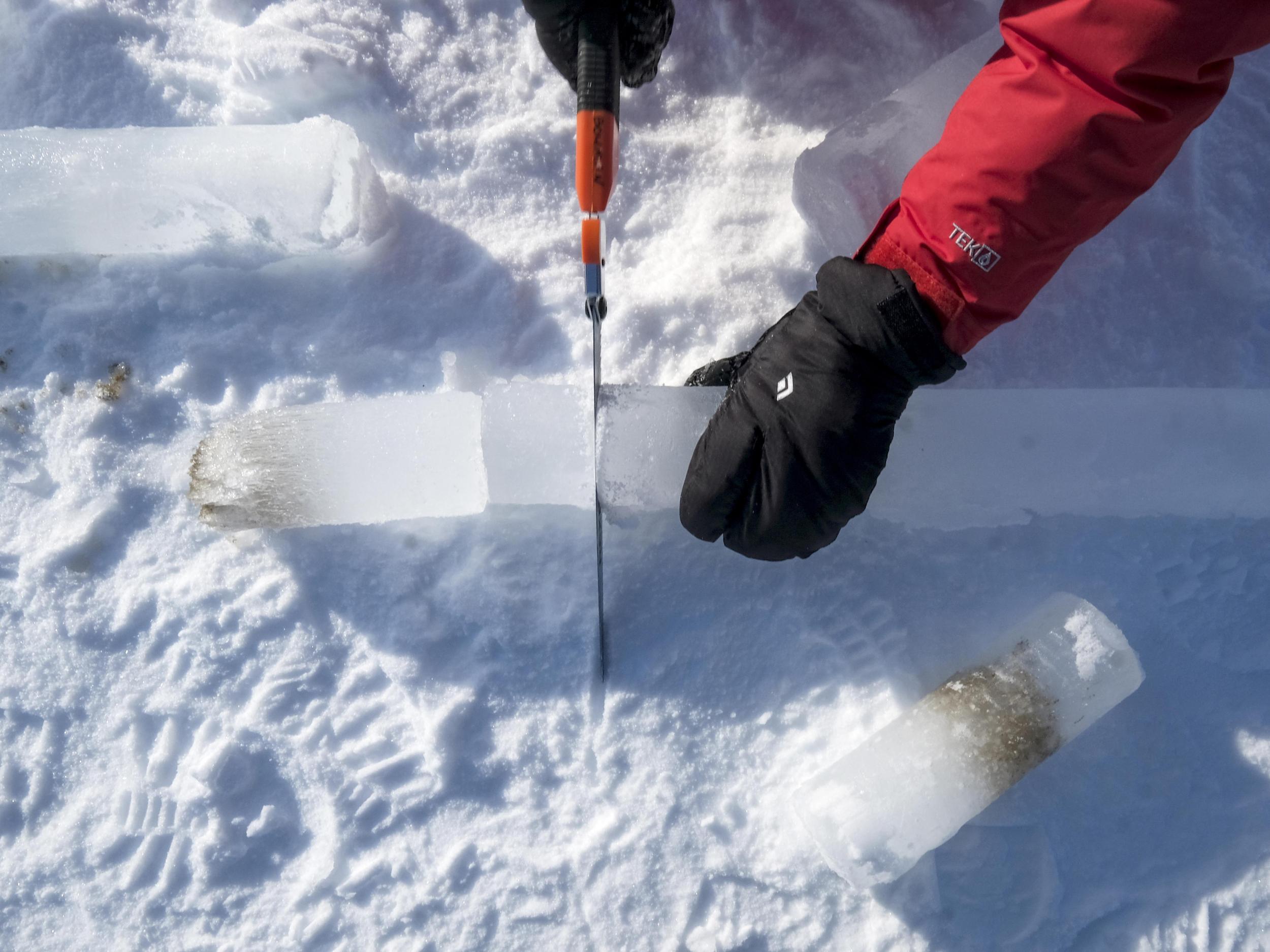 Byron Blomquist slices an ice core