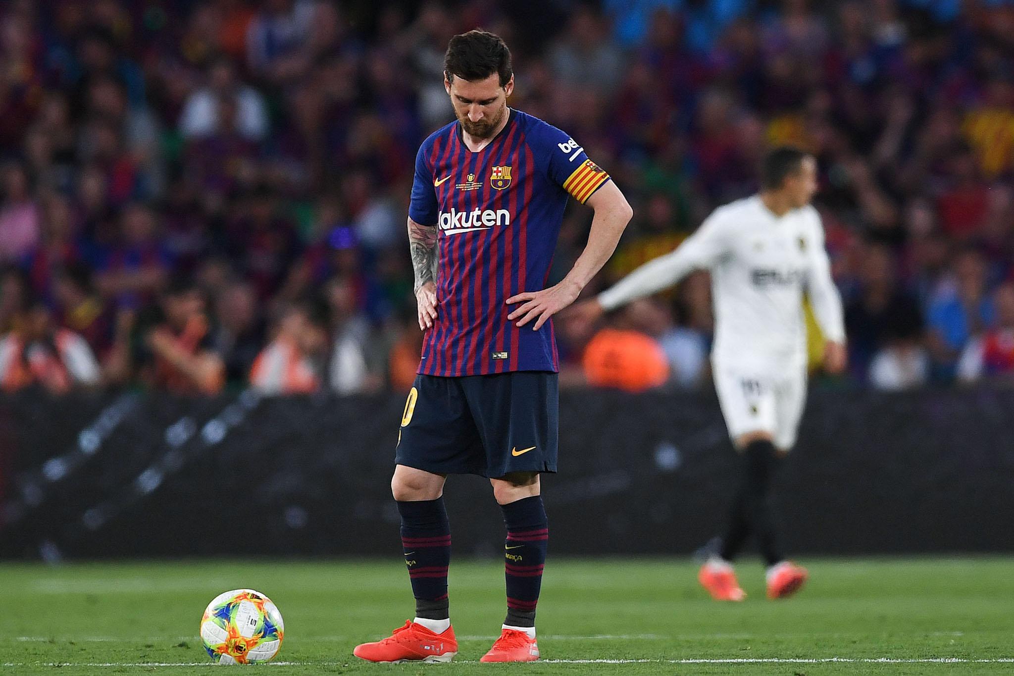 Lionel Messi of FC Barcelona shows his dejection after Rodrigo Moreno of Valencia CF scored his team's second goal during the Spanish Copa del Rey match