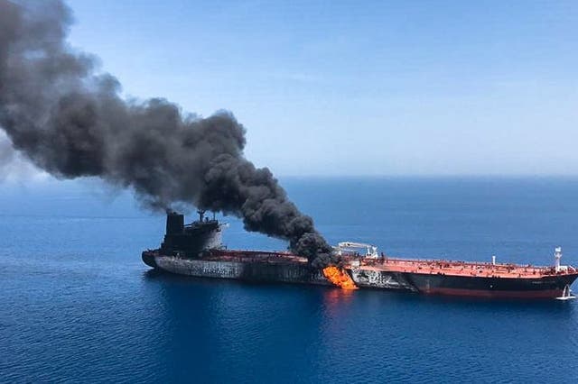 Fire and smoke billow from a tanker said to have been attacked in the waters of the Gulf of Oman
