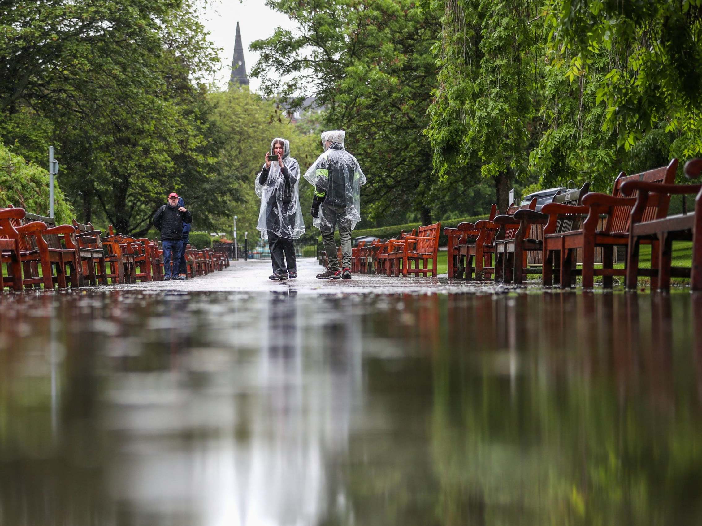 A flooded footpath in Edinburgh's Princes Street Gardens; the downpours caught many tourists by surprise