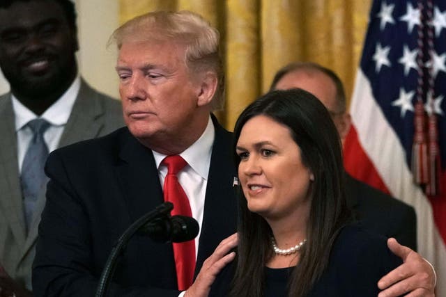 US president Donald Trump and White House press secretary Sarah Huckabee Sanders share a moment in the East Room