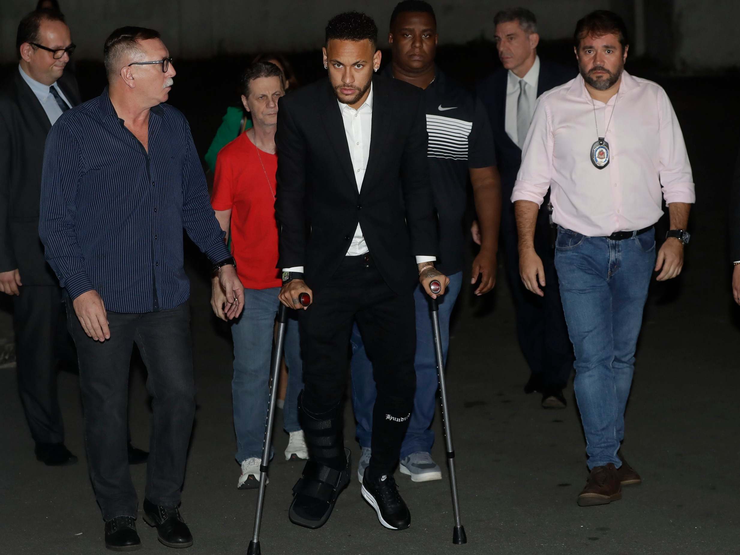 Neymar leaves a police station in Sao Paulo