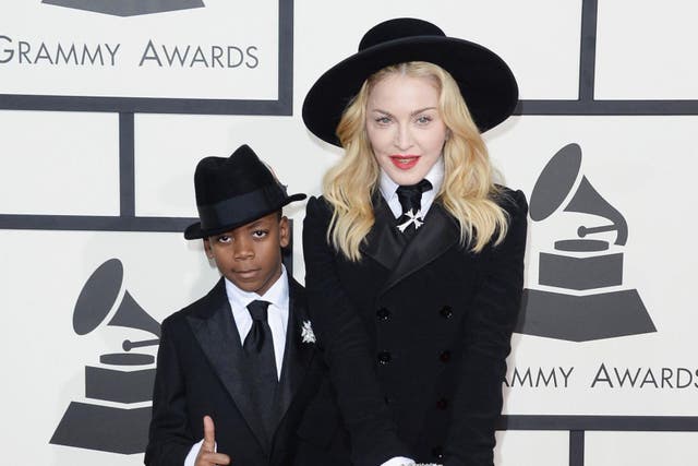 Singer Madonna (R) and son David Banda Mwale Ciccone Ritchie attend the 56th GRAMMY Awards at Staples Center on January 26, 2014 in Los Angeles, California.