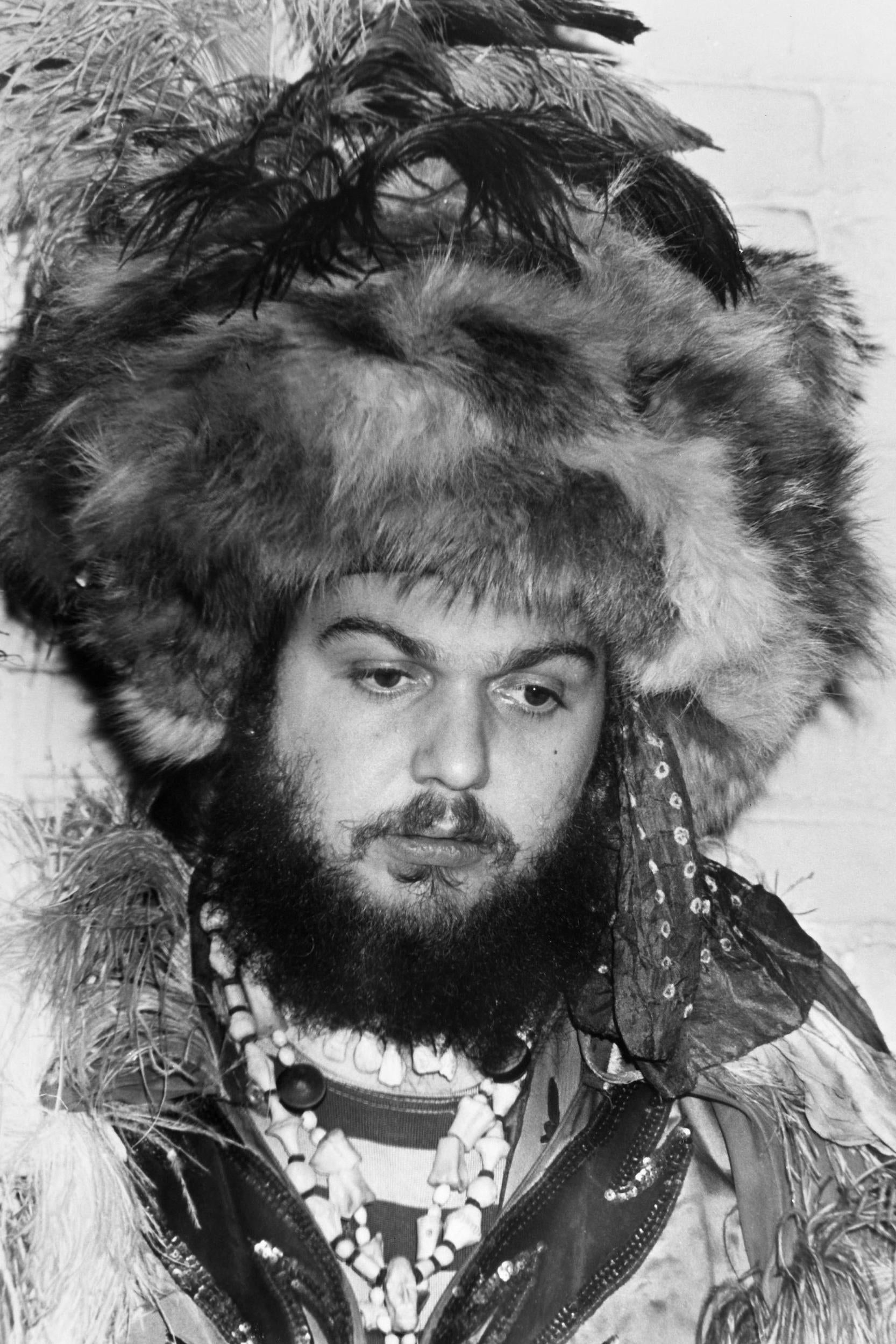 Dr John in signature headdress, feathers, rings and beads (Rex)