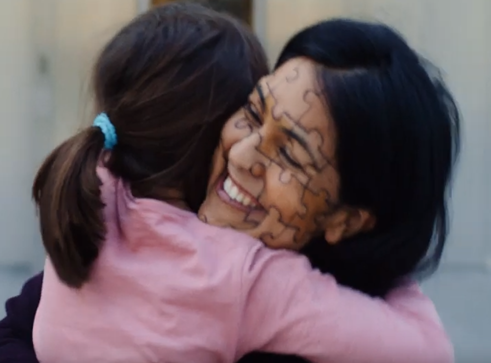 A woman and child hug in a clip from the British Red Cross campaign for Refugee Week