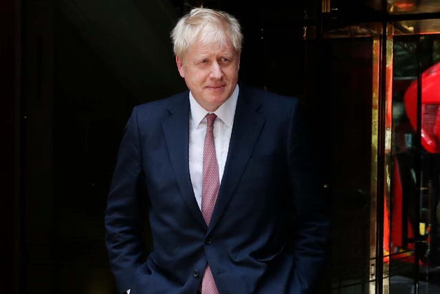 Johnson leaving an interview in London, as his potential strategy as PM remains unclear