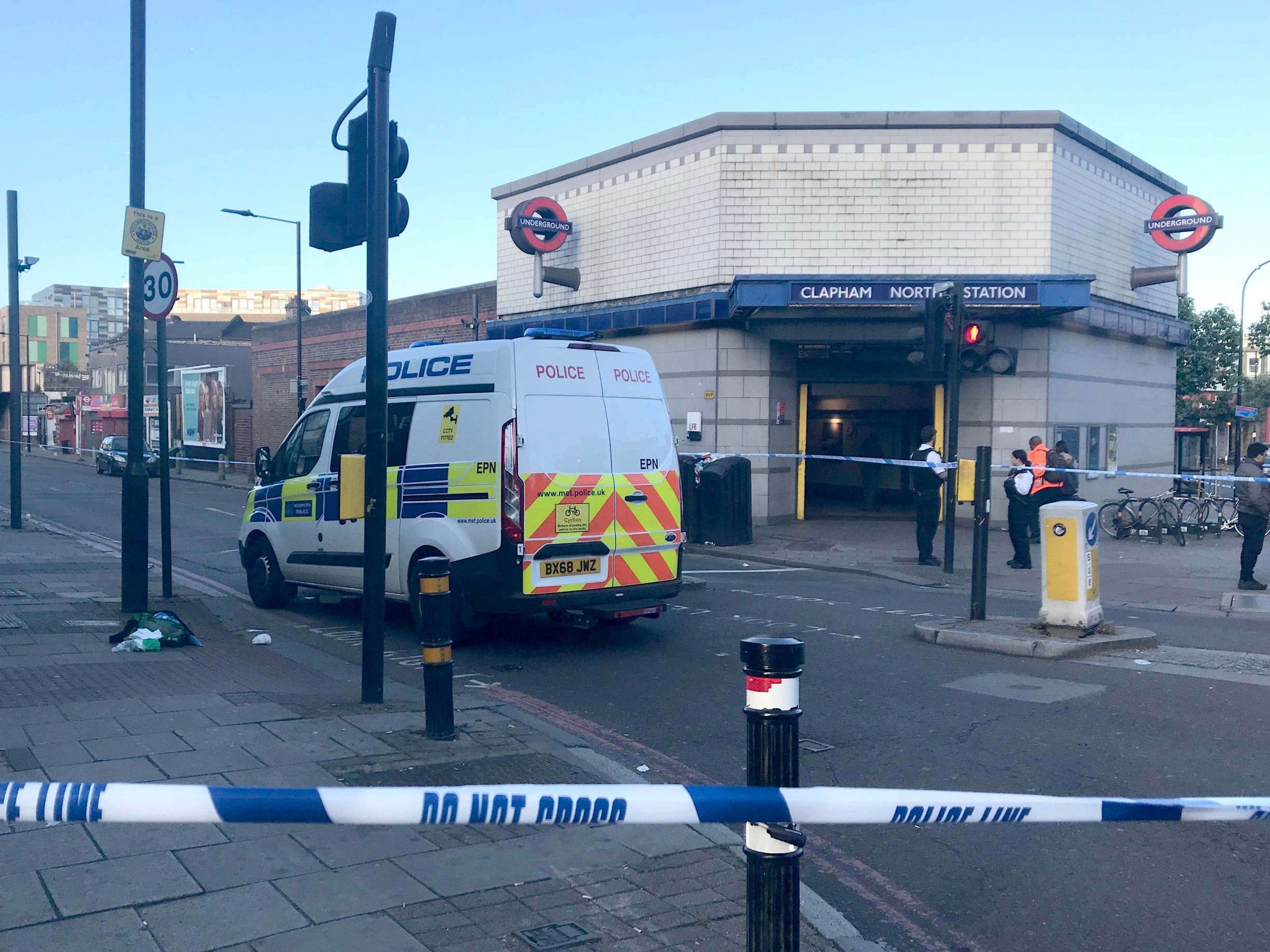 Police cordon on Bedford Road in Clapham after three men stabbed