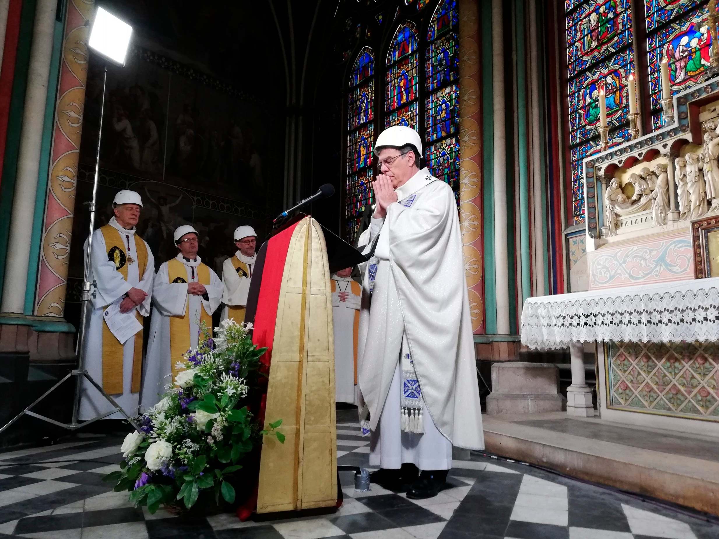Notre Dame hosts first mass since devastating fire as billionaires' offers of cash fail to materialise
