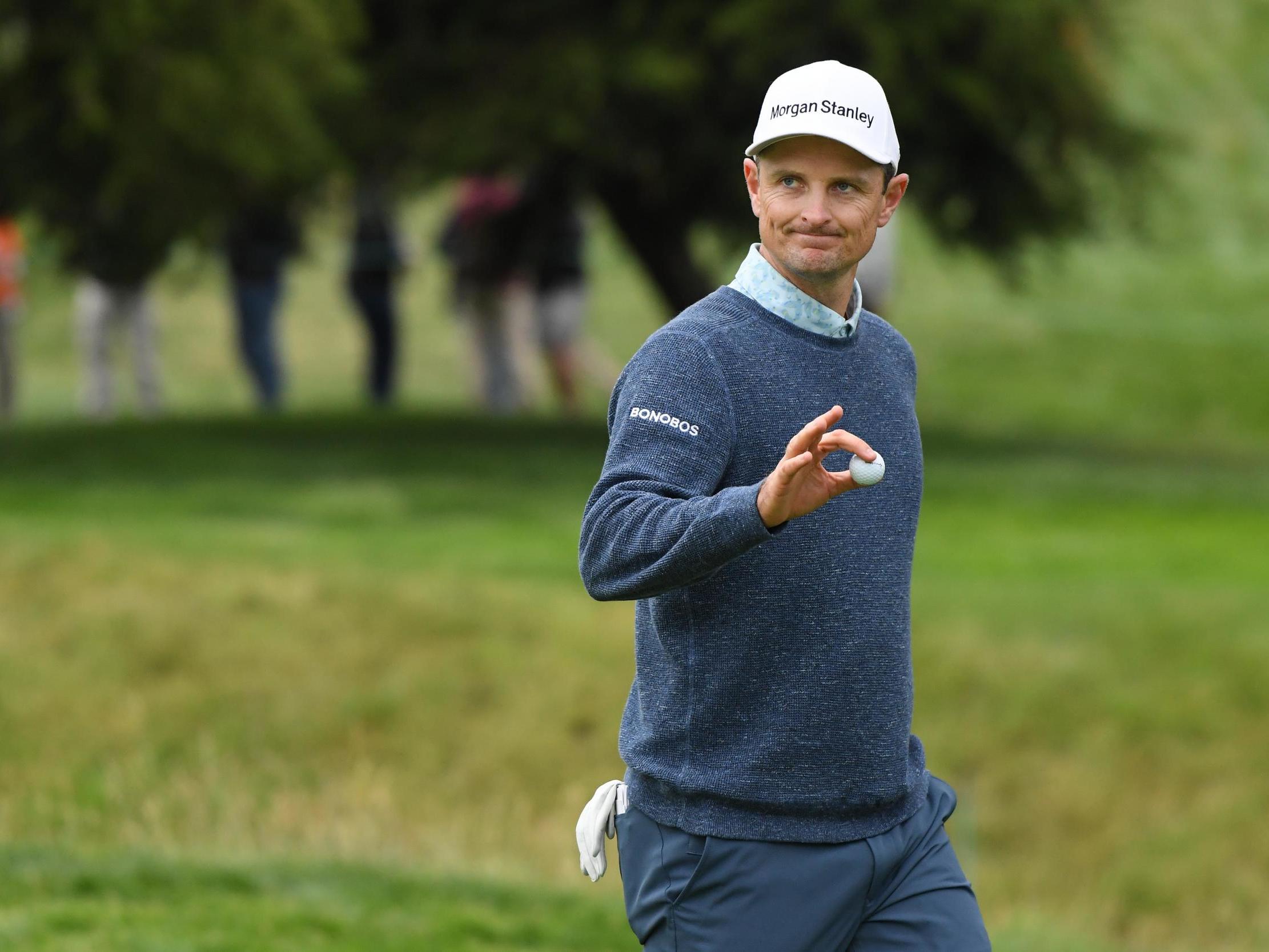 Justin Rose acknowledges the crowds after a putt during the third round