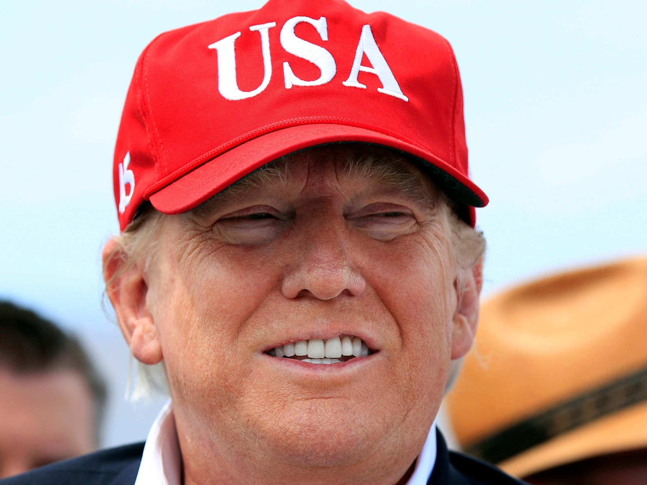 Donald Trump speaks to reporters during a visit to Florida