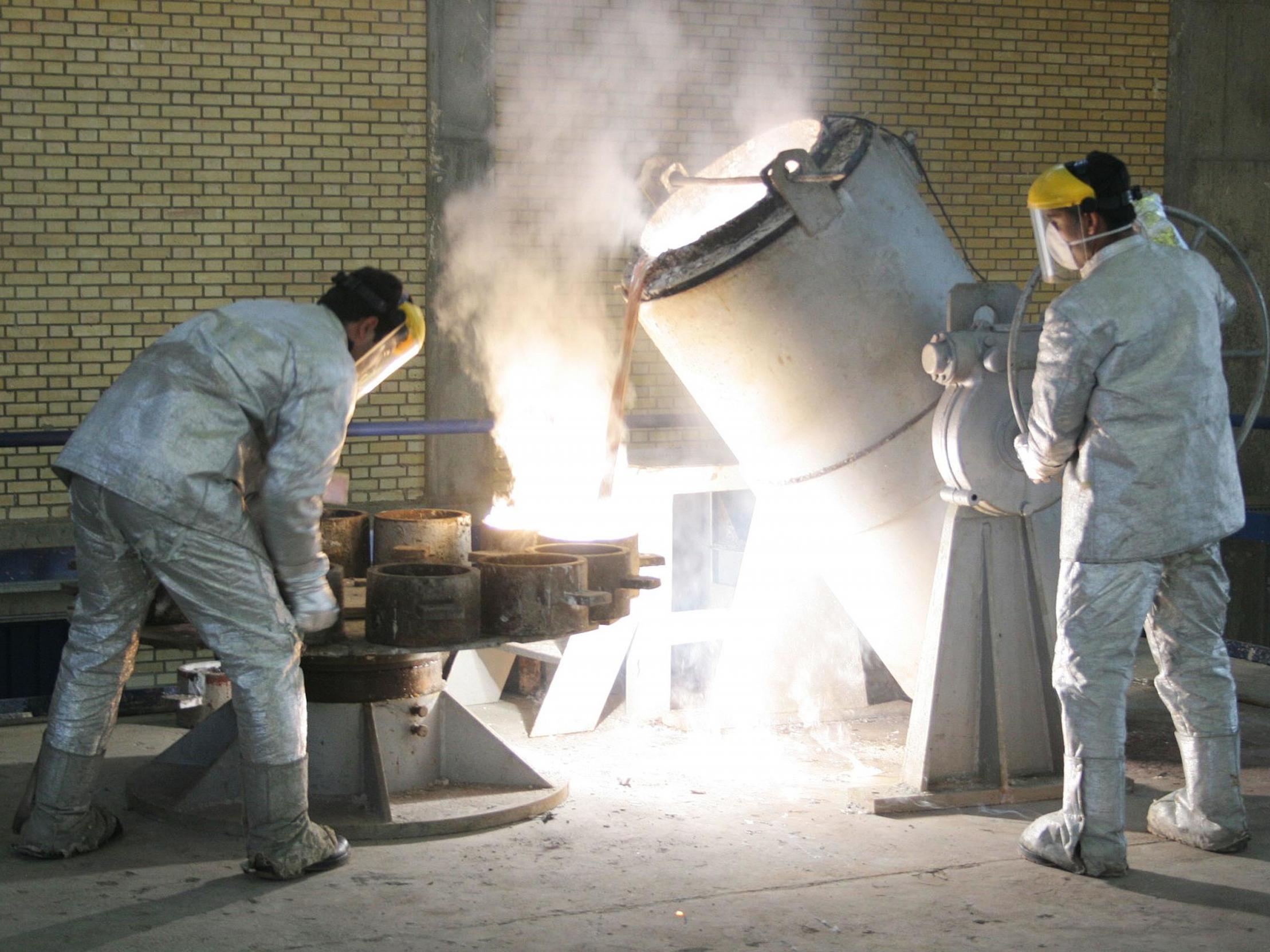 Technicians work inside a uranium conversion facility which makes hexaflouride gas just outside the city of Isfahan, in Iran