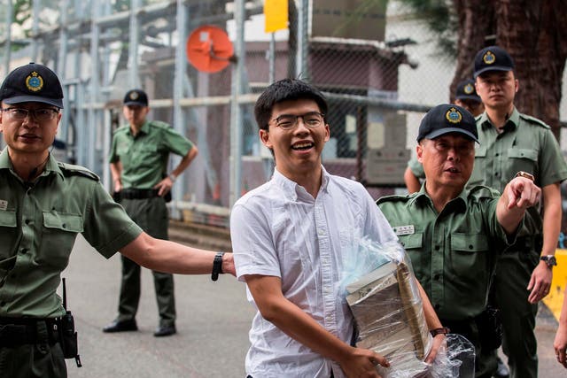 Hong Kong democracy activist Joshua Wong leaves Lai Chi Kok Correctional Institute in Hong Kong on Monday